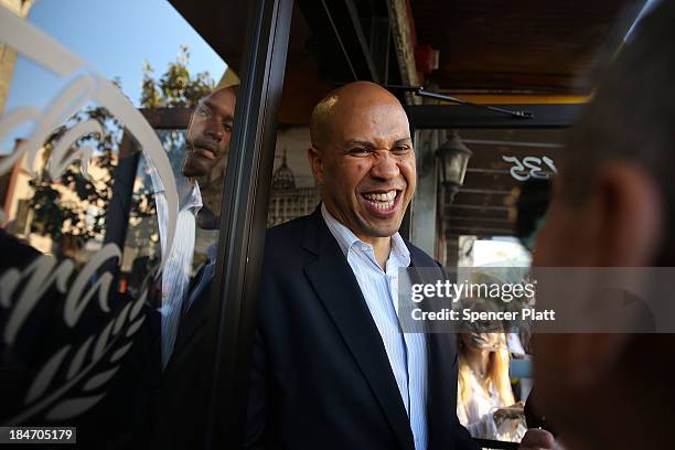 Cory Booker, Newark Mayor and Democratic candidate in tomorrow's U.S. Senate special election in New Jersey, campaigns in downtown Newark on October...