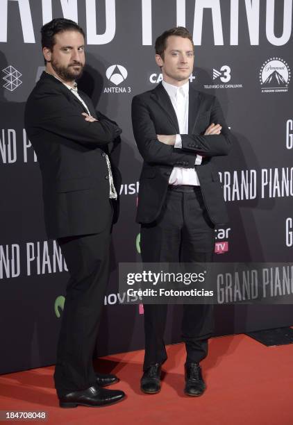 Director Eugenio Mira and actor Elijah Wood attend the premiere of 'Grand Piano' at Capitol cinema on October 15, 2013 in Madrid, Spain.