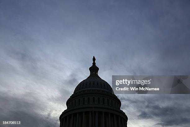 The U.S. Capitol is shown at sunset October 15, 2013 in Washington, DC. The U.S. Government shutdown is in its fifteenth day as the U.S. Senate and...