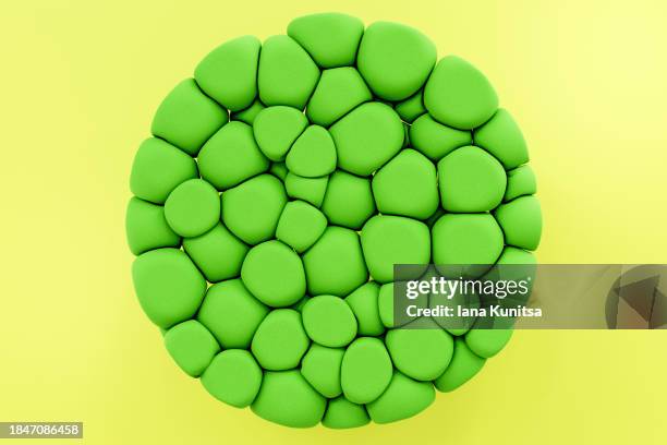 abstract green sphere on yellow background. ecology,  earth planet concept. 3d pattern, design element. geometric composition. - sphère 3d photos et images de collection