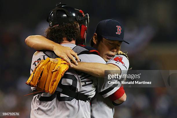 Koji Uehara celebrates with Jarrod Saltalamacchia of the Boston Red Sox after their 1 to 0 win over the Detroit Tigers during Game Three of the...