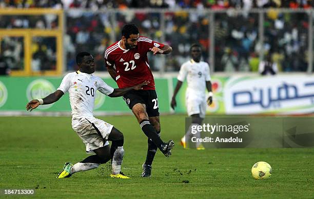 Ghanaian Kwadwo Asamoah and Egyptian Mohamed Aboutrika vie for the ball during the 2014 World Cup African qualifying first leg play-off match between...