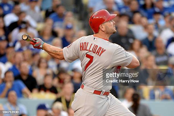Matt Holliday of the St. Louis Cardinals hits a two-run home run in the third inning against the Los Angeles Dodgers in Game Four of the National...