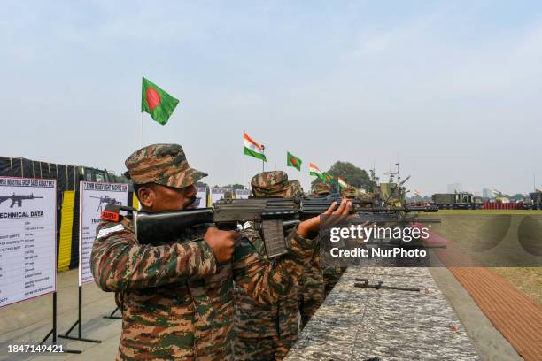 Army officers are displaying various weapons during the ''Military Tattoo'' practice event ahead of Vijay Diwas celebrations in Kolkata, India, on...