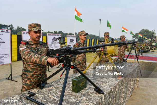 Army officers are displaying various weapons during the ''Military Tattoo'' practice event ahead of Vijay Diwas celebrations in Kolkata, India, on...