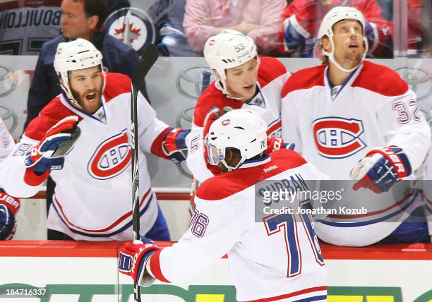 Subban of the Montreal Canadiens celebrates a first period goal against the Winnipeg Jets with teammates Brandon Prust, Ryan White and Travis Moen at...
