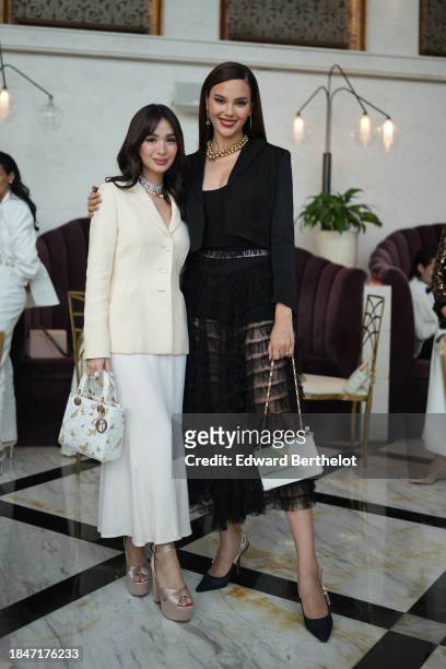 Catriona Gray , Miss Universe 2018 and actress Heart Evangelista , are seen during the Dior Carousel of Dreams Launch Event in Manila, on November...