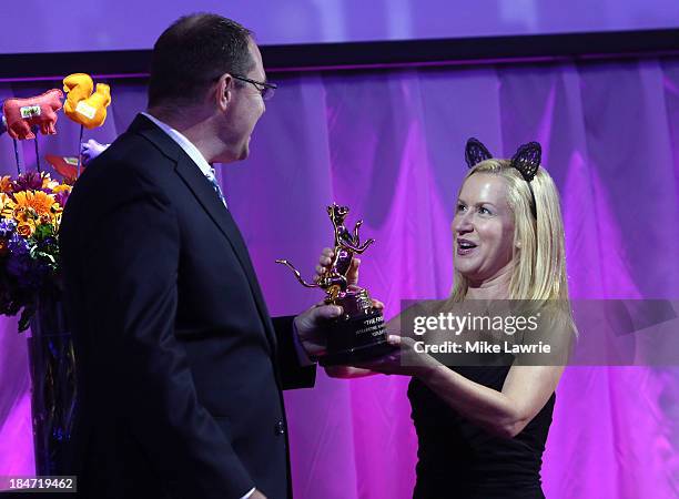 Actress Angela Kinsey presents the Lifetime Achievement Award to Bryan Bundesen during The Friskies 2013 at Arena NYC on October 15, 2013 in New York...