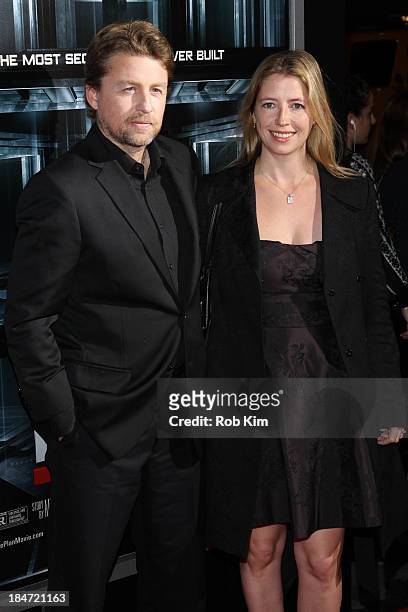 Director Mikael Hafstrom and guest attend "Escape Plan" New York Premiere at Regal E-Walk on October 15, 2013 in New York City.