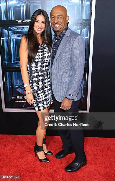 Tara Fowler and Montel Williams attend the "Escape Plan" premiere at Regal E-Walk on October 15, 2013 in New York City.