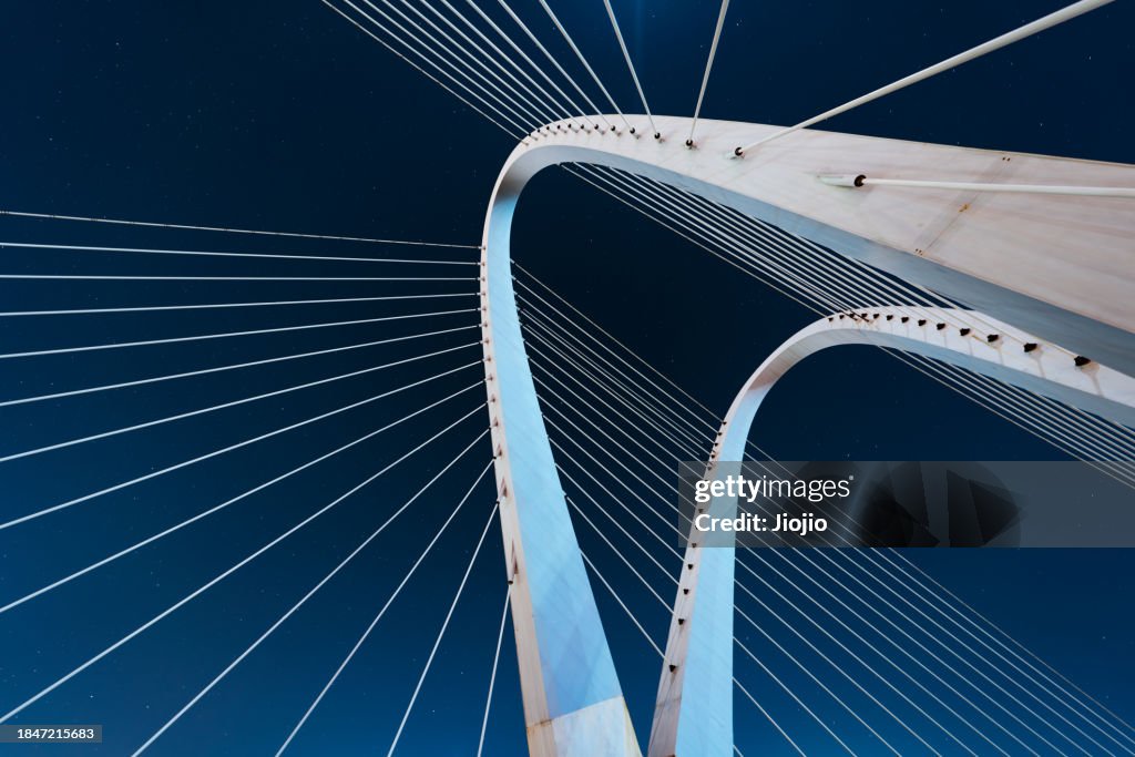 Modern bridge against starfield