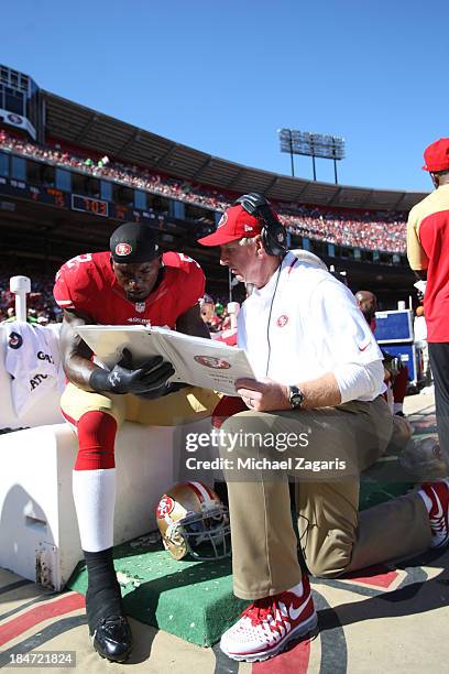 Linebackers Coach Jim Leavitt of the San Francisco 49ers talks with Patrick Willis during the game against the Arizona Cardinals at Candlestick Park...