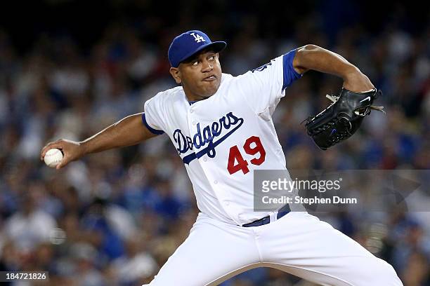 Carlos Marmol of the Los Angeles Dodgers pitches in the eighth inning against the St. Louis Cardinals in Game Four of the National League...