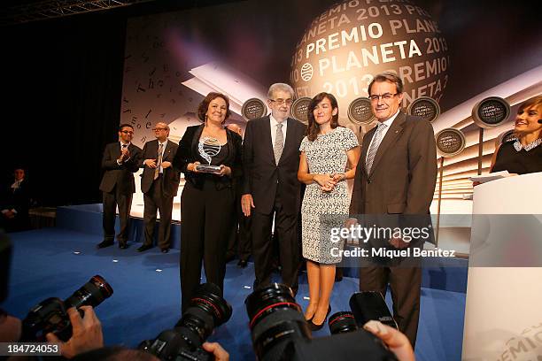 Writer Clara Sanchez poses with her award, Jose Manuel Lara Bosch CEO of Grupo Planeta, Angeles Gonzalez-Sinde and Catalonia's regional government...