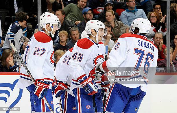 Alex Galchenyuk, David Desharnais, Daniel Briere and P.K. Subban of the Montreal Canadiens celebrate a third period goal against the Winnipeg Jets at...