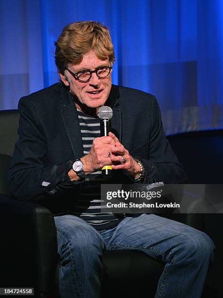 Actor Robert Redford speaks to the audience at an official Academy members screening of "All Is Lost" hosted by The Academy Of Motion Picture Arts...