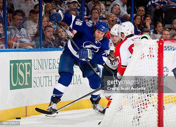 Pierre-Cedric Labrie Tampa Bay Lightning battles for the puck against the Florida Panthers at the Tampa Bay Times Forum on October 10, 2013 in Tampa,...