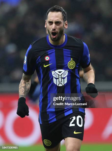 Hakan Calhanoglu of FC Internazionale celebrates scoring their team's first goalduring the Serie A TIM match between FC Internazionale and Udinese...