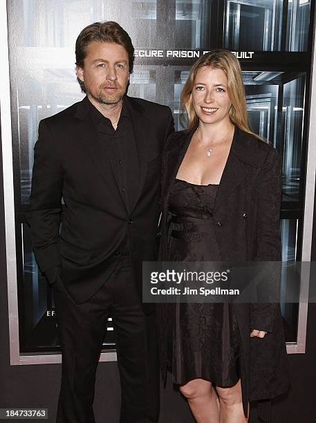 Director Mikael Hafstrom and Kelly Dennis attend "Escape Plan" New York Premiere at Regal E-Walk on October 15, 2013 in New York City.