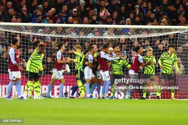 Players from both side's await a corner kick during the Premier League match between Aston Villa and Arsenal FC at Villa Park on December 09, 2023 in...