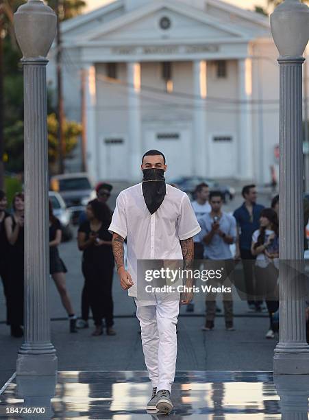 Model walks the runway at the Ashton Michael Spring 2014 Collection show on October 15, 2013 in Hollywood, California.