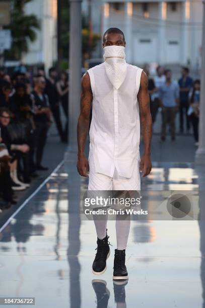 Model walks the runway at the Ashton Michael Spring 2014 Collection show on October 15, 2013 in Hollywood, California.