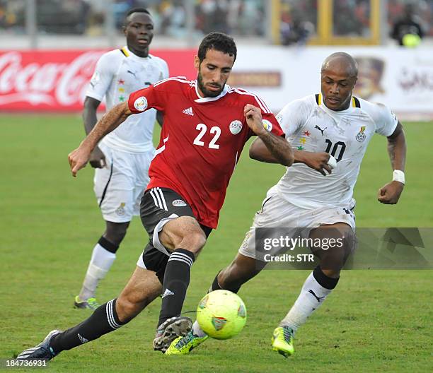 Egypt's Mohamed Aboutrika vies with Ghana's Andre Ayew during the Fifa World Cup 2014 qualifying football match Ghana vs Egypt, on October 16, 2013...