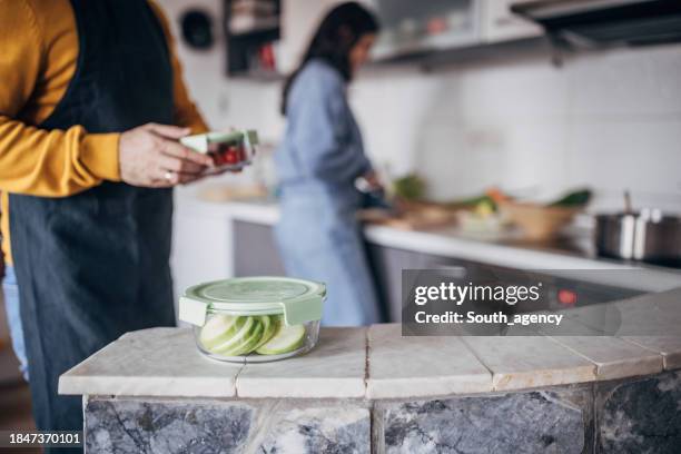 preparing fresh produce for storage in kitchen - compostable stock pictures, royalty-free photos & images