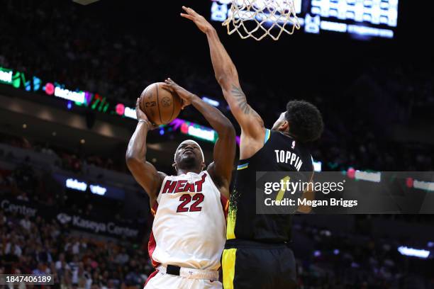 Jimmy Butler of the Miami Heat shoots the ball against Obi Toppin of the Indiana Pacers during the second quarter of the game at Kaseya Center on...