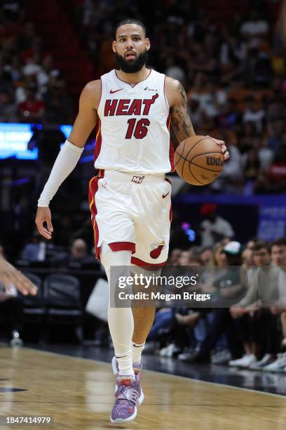 Caleb Martin of the Miami Heat dribbles the ball against the Indiana Pacers during the first quarter at Kaseya Center on December 02, 2023 in Miami,...