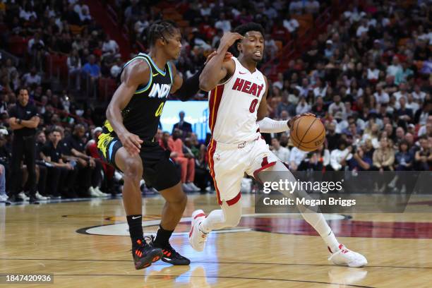 Josh Richardson of the Miami Heat dribbles the ball against the Indiana Pacers during the second quarter at Kaseya Center on December 02, 2023 in...