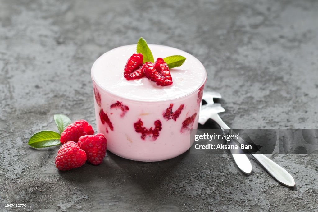 Vegan Raspberry Tiramisu. Dark background. Close-up