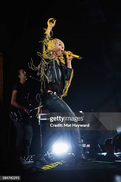 Emily Haines of Metric performs on stage at Key Arena on October 15, 2013 in Seattle, Washington.