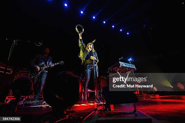 Emily Haines of Metric performs on stage at Key Arena on October 15, 2013 in Seattle, Washington.