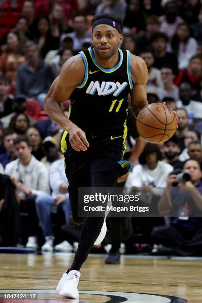 Bruce Brown of the Indiana Pacers dribbles the ball against the Miami Heat during the fourth quarter of the game at Kaseya Center on December 02,...