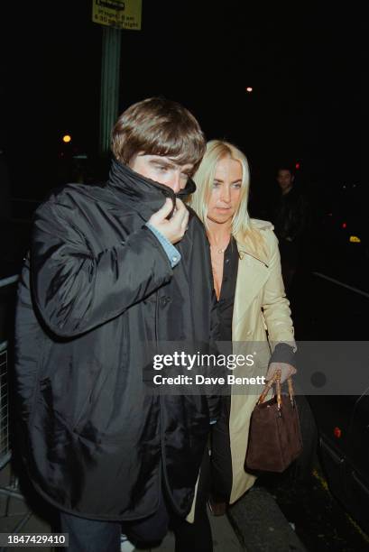 English musician Noel Gallagher and Meg Mathews leaving Browns nightclub in London, September 1996.