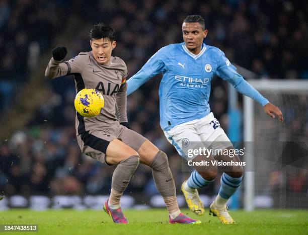 Son Heung-Min of Tottenham Hotspur and Manuel Akanji of Manchester City in action during the Premier League match between Manchester City and...