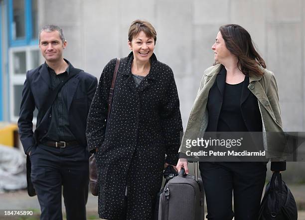 Green Party Member of Parliament Caroline Lucas arrives at Crawley Magistrates Court with her barrister and an assistant on October 16, 2013 in...
