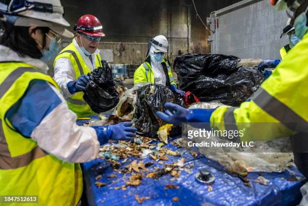 Team from Stony Brook University sorts through garbage at Covanta's Westbury, New York incinerator on Nov. 27, 2023. The team which is currently...