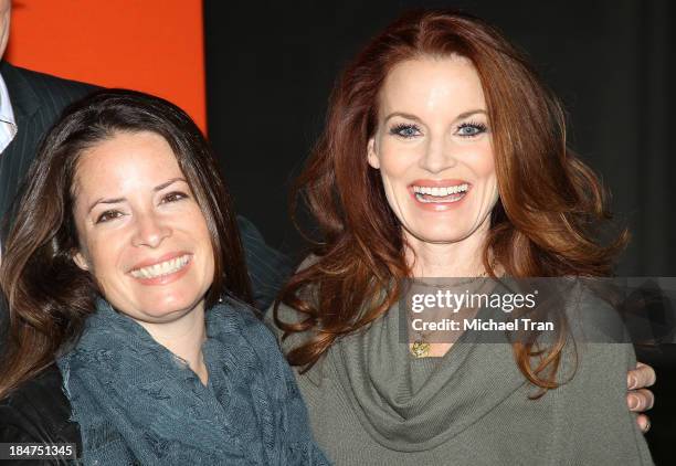 Holly Marie Combs and Laura Leighton arrive at the "Pretty Little Liars" celebrates Halloween episode held at Hollywood Forever on October 15, 2013...