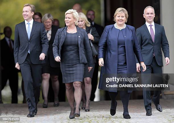 Norway's incoming Prime Minister Erna Solberg , new local government minister Jan Tore Sanner and new finance minister Siv Jensen and Foreign...