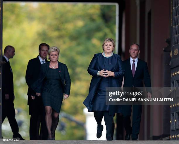 Norway's incoming Prime Minister Erna Solberg , new local government minister Jan Tore Sanner and new finance minister Siv Jensen leave the Royal...