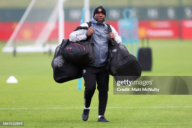 Benni McCarthy, Coach of Manchester United looks on during a training session at Carrington Training Ground on December 11, 2023 in Manchester,...