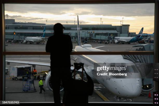 Planes on the tarmac at Terminal 3 of Toronto Pearson International Airport in Toronto, Ontario, Canada, on Saturday, Dec. 9, 2023. The Greater...