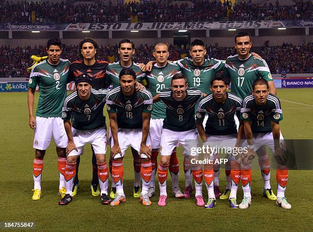 The Mexican national football team poses for pictures before their Brazil 2014 FIFA World Cup Concacaf qualifier match against Costa Rica, at the...