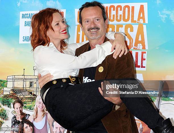 Barbora Bobulova and Rocco Papaleo attend "Una Piccola Impresa Meridionale" Photocall at Terrazza Martini on October 16, 2013 in Milan, Italy.