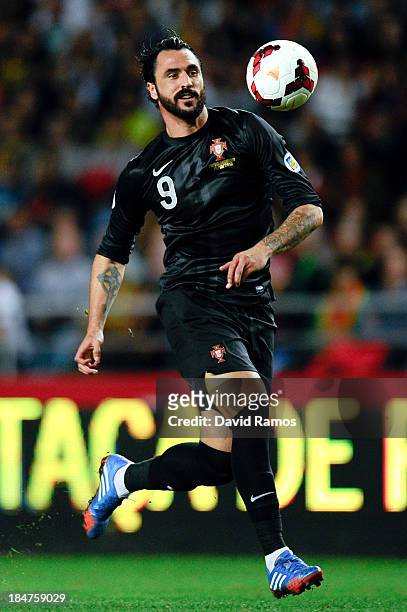 Hugo Almeida of Portugal runs with the ball during the FIFA 2014 World Cup Qualifier match between Portugal and Luxembourg at Estadio Cidade de...