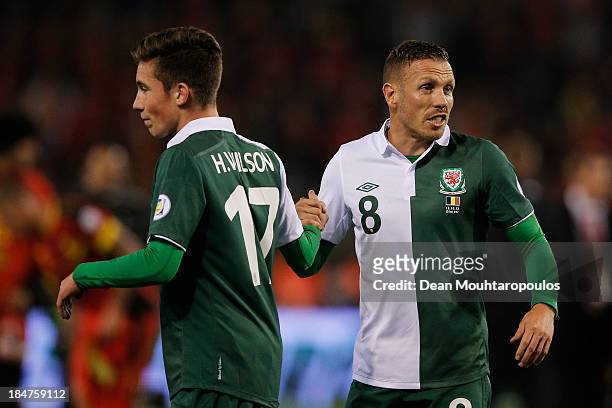 Craig Bellamy and Harry Wilson of Wales shake hands after the FIFA 2014 World Cup Qualifying Group A match between Belgium and Wales at King Baudouin...