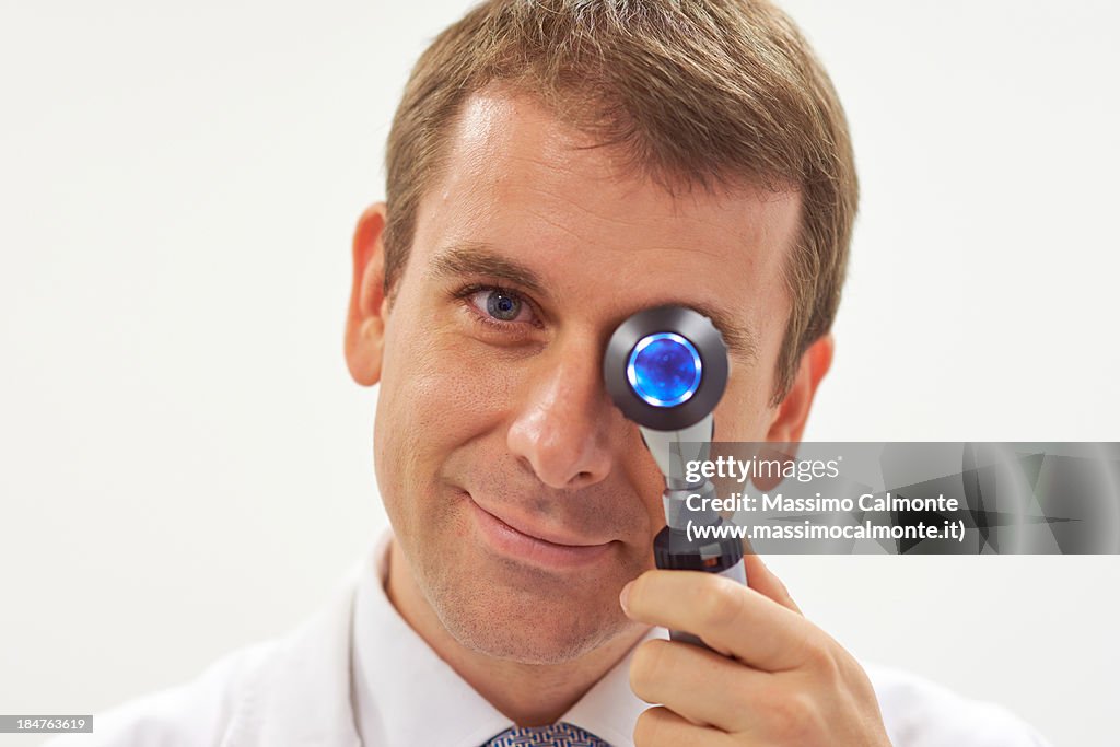 Dermatologist with dermatoscope