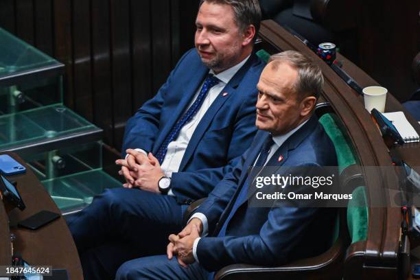 The leader of Civic Coalition , Donald Tusk stands among party members as he receives nomination for Prime Minister during a parliament session on...